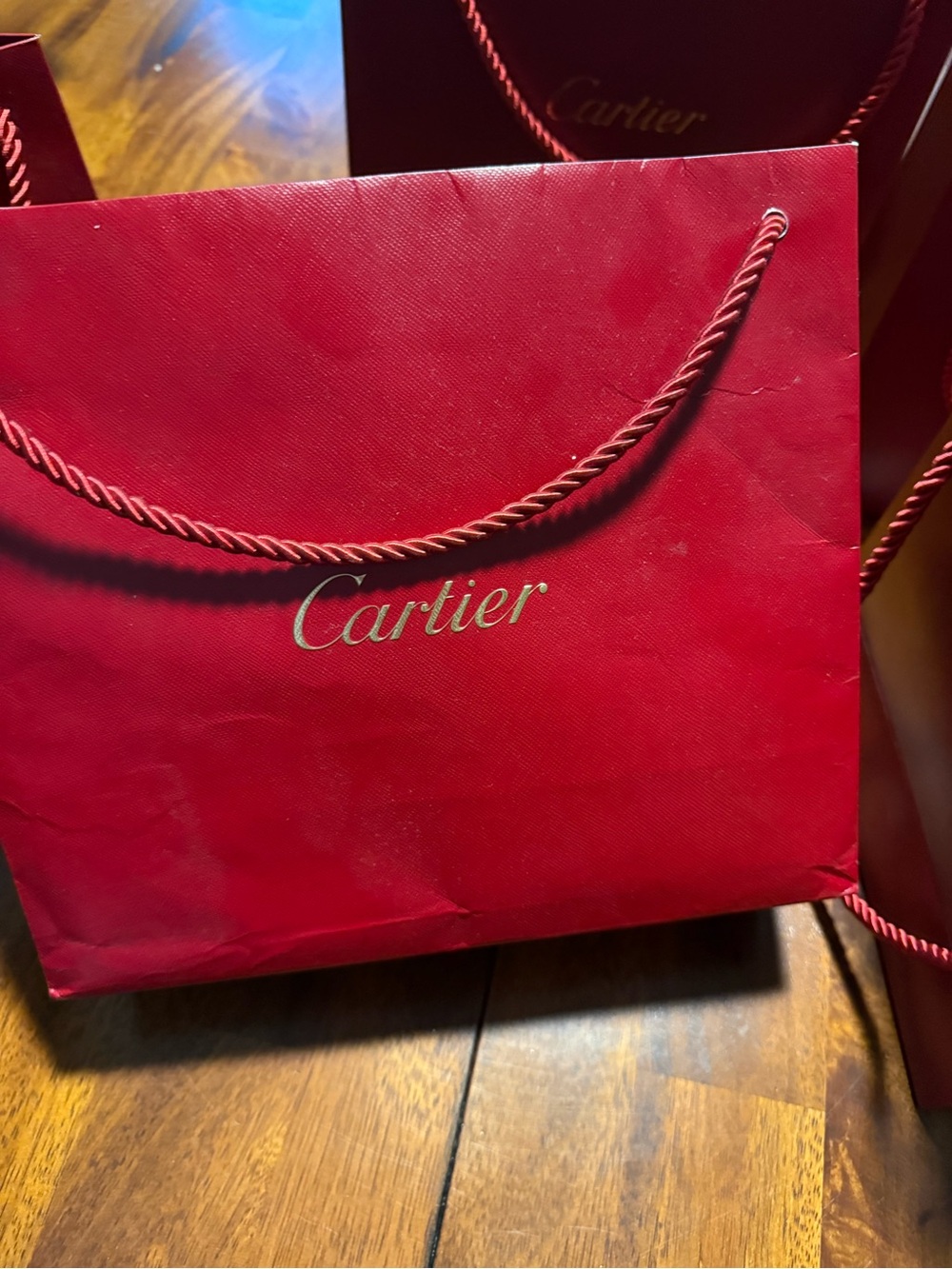 Cartier Red Shopping Bag with Gold Logo and Rope Handles